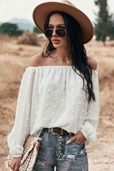 Off shoulder dotted top from women's boutique, perfect for summer.