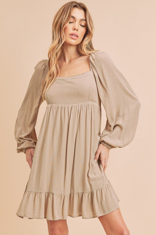 Taya Dress in beige, elegant style for women’s boutique wear.
