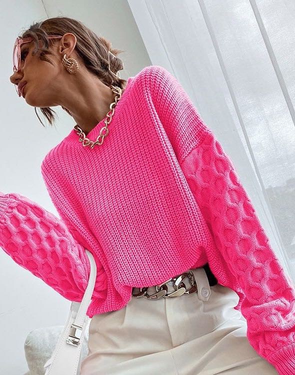Knit sweater from a women's boutique, bright pink, stylish and trendy.