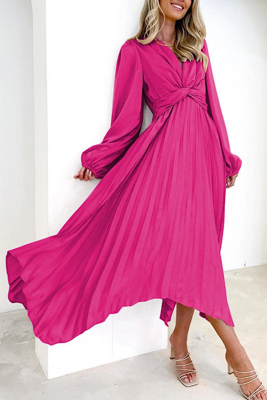 Pleated long sleeve dress in vibrant pink at women’s boutique