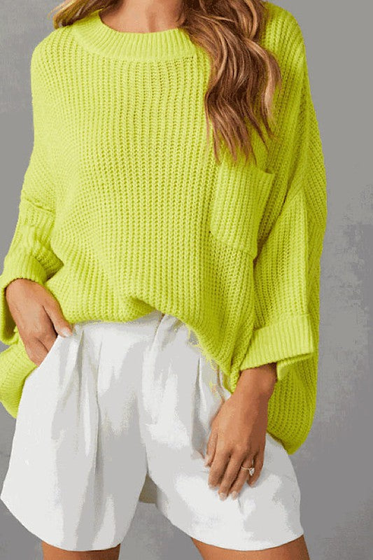 Oversized knit sweater top in vibrant yellow paired with white shorts, perfect for trendy women’s clothing and modern women’s fashion.