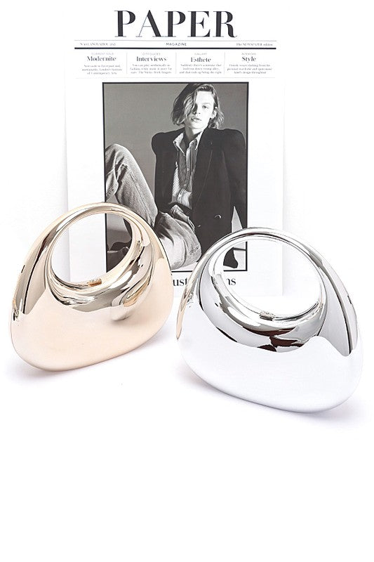 Polished Molded Top Handle Clutch showcasing elegant design, part of a women’s clothing boutique collection for stylish women.
