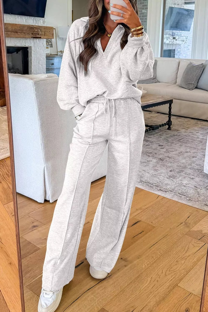 Long Sleeve Sweatshirt and Pants Set displayed in a stylish women's boutique living room, showcasing modern women's fashion.