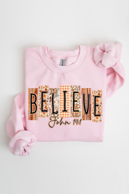 Believe Fall Christian Graphic Sweatshirt from a women's boutique, featuring trendy design for casual women's fashion.
