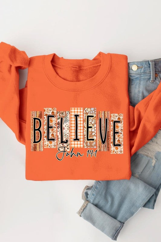 Believe Fall Christian Graphic Sweatshirt in orange, perfect for women’s boutique, stylish women’s clothing and trendy ladies tops.