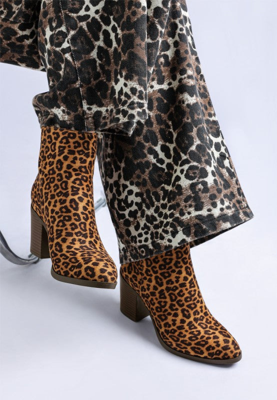 Lunara Leopard Print Block Heel Boots paired with leopard print pants
