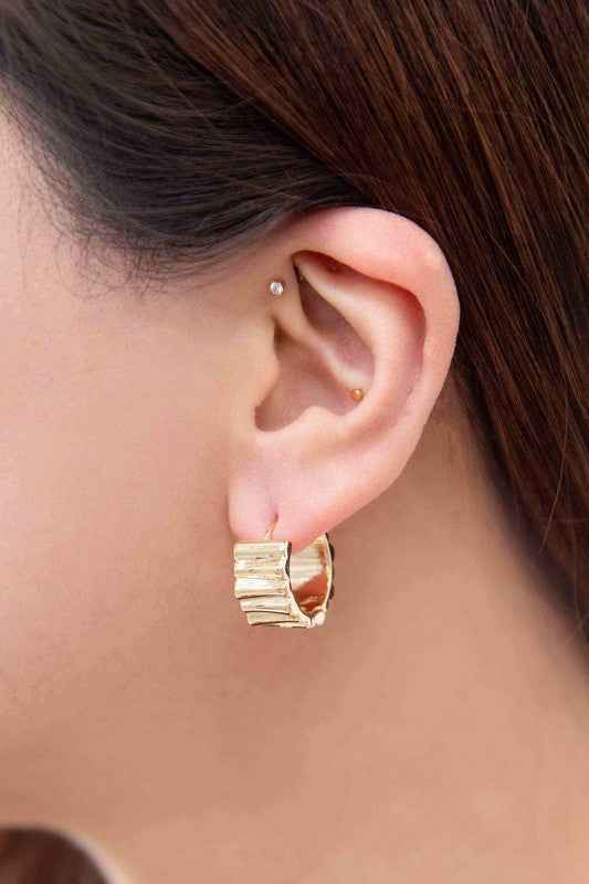 Ripple Hoop Earrings in gold, trendy boutique jewelry for women.