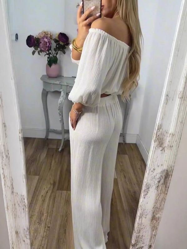 Full Size Off-Shoulder Top and Pants in all sizes including Set Plus Size worn by model, showcasing ladies fashion in stylish white.