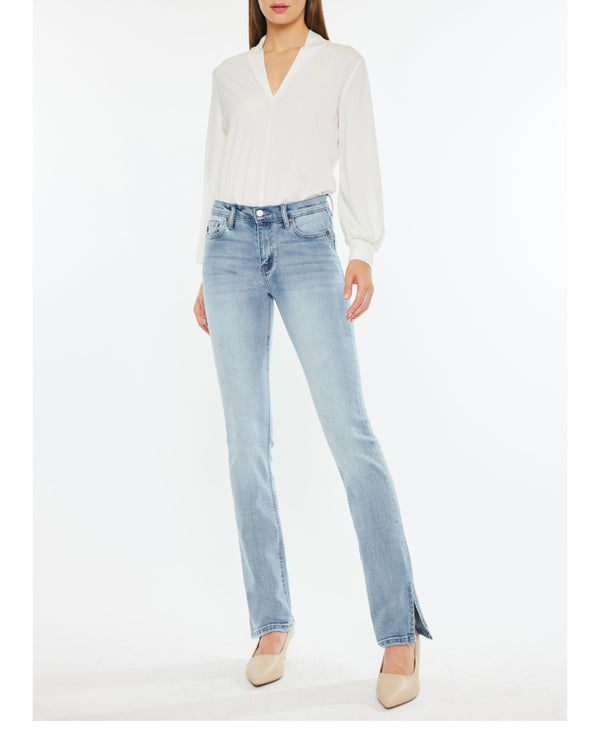 KanCan Mid Rise Y2K Boot Cut Light color Mid Wash Jean - Ever Grace by C'est La Vie' modeled with a white blouse.