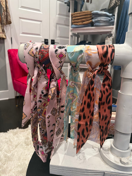 Mini Scarf - Evergrace by C'estlavie on display in a women’s boutique, showcasing trendy patterns and colors for stylish women’s clothing.