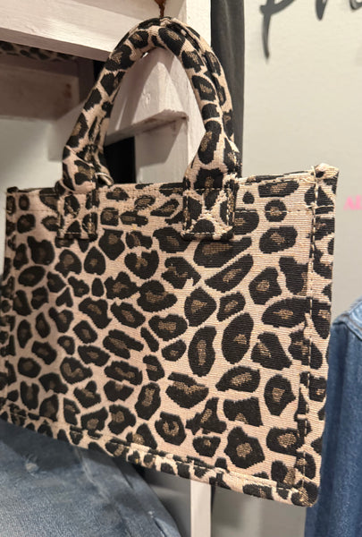 Leopard Crossbody Tote - Evergrace by C'estlavie displayed in a women’s boutique, showcasing stylish women’s clothing.