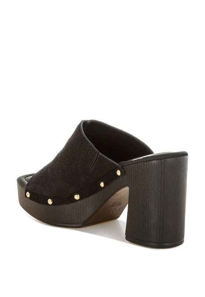 Stylish black suede heeled mules with gold studs, perfect for women’s boutique fashion and casual dresses.