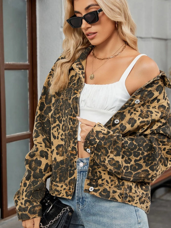 Stylish woman wearing a Leopard Print Button Up Denim Jacket from a women’s boutique, perfect for casual looks.