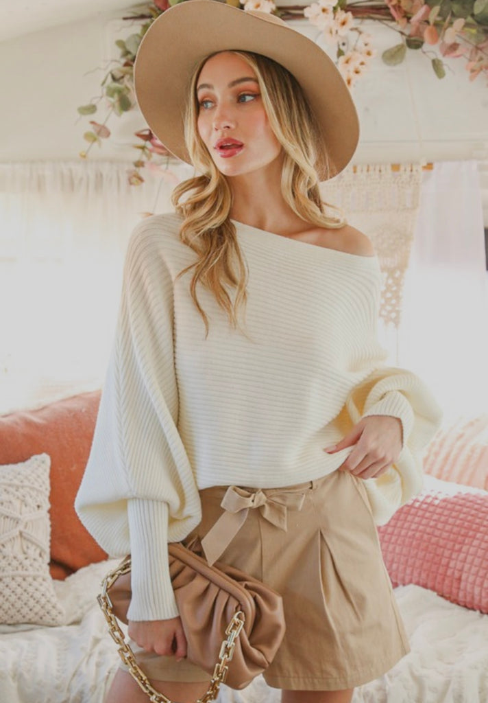 Boat Neck Elegant Ribbed Knitted Solid Loose Sweater paired with stylish shorts, showcasing modern women's fashion.